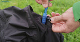 Drink tube routing: openings and securing points on the shoulder straps