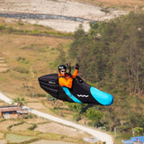 Woody Valley GTO light paragliding pod harness with Blue-Black speedbag (leg cover) fitted