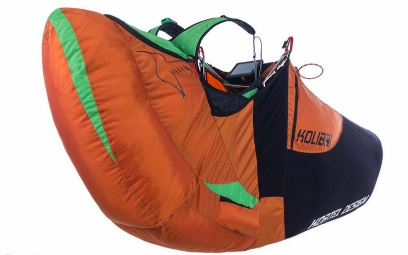 Paragliding harness with large stowage area