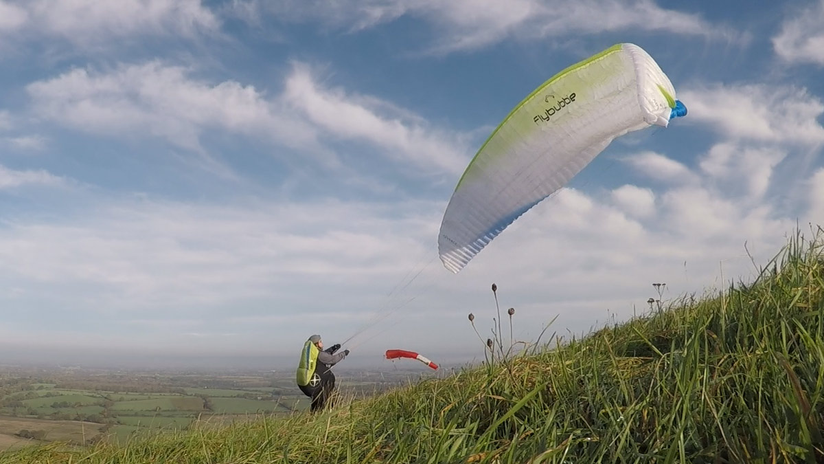 Depower a paraglider: using rear risers