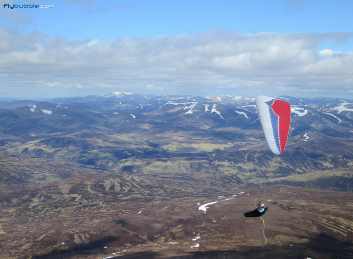 Richard Carter flying over the Cairngorms during the North South Cup in Scotland.